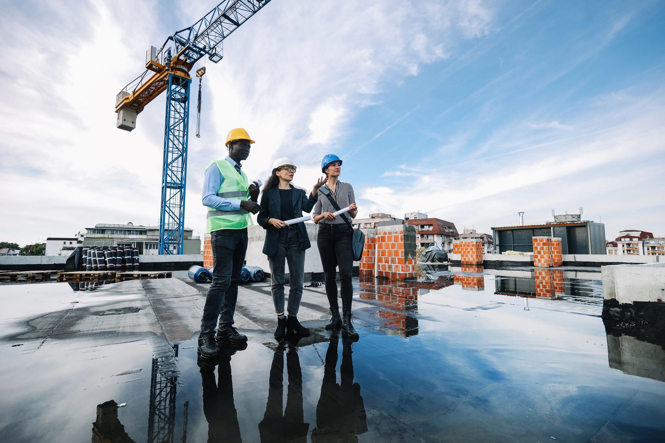 Property development planning meeting at a construction site